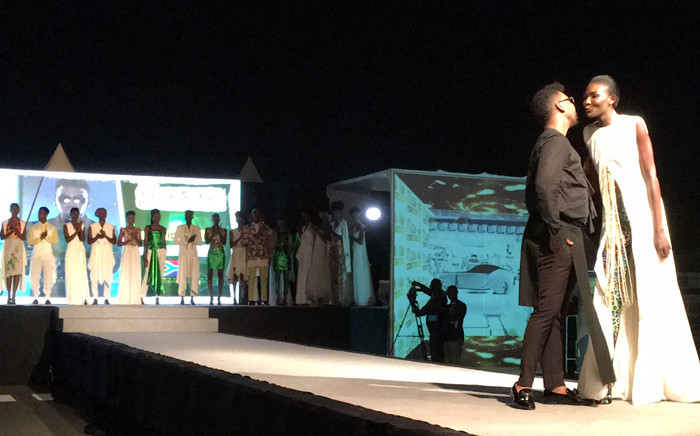 David Tlale on stage at his first show in the Ivory Coast. Picture: Leanne de Bassompierre/EWN.