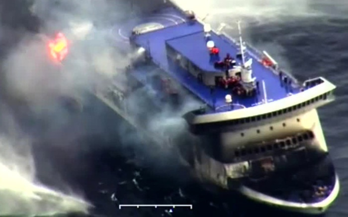 A photo grab taken from a video made available by the Guardia costiera, Italy’s coast guard organisation on December 28, 2014, shows the burning ferry Norman Atlantic adrift off Albania. Picture: AFP.