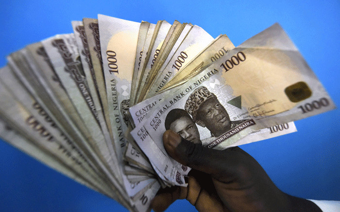 FILE: This picture taken on 29 January 2016 in Lagos shows 1000 naira banknotes, Nigeria's currency. Picture: AFP.