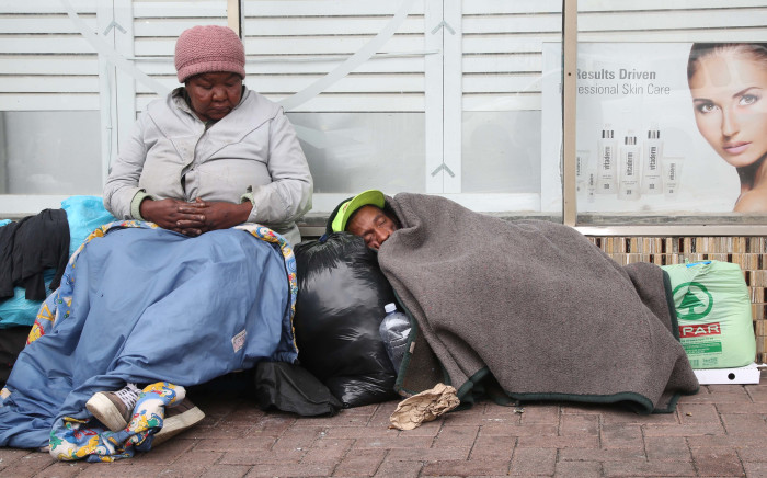 Margriet Pienaar sits under a blanket on a cold winters day in Cape Town. Pienaar has been living on the street for 15 years. Picture: Bertram Malgas/EWN