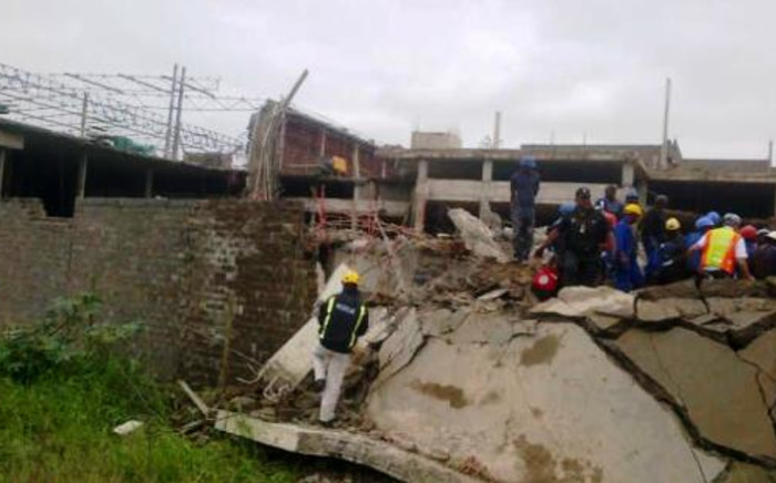 Emergency and construction workers among the rubble at the site of a collapsed mall in Tongaat, KwaZulu-Natal, on 19 November 2013. Picture: @Mariolungelo/Twitter.