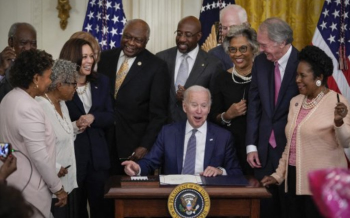US President Joe Biden signs the Juneteenth National Independence Day Act into law in the East Room of the White House on 17 June 2021 in Washington, USA. Picture: AFP 