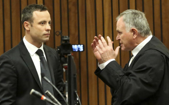 Oscar Pistorius and defence advocate Barry Roux at the North Gauteng High Court in Pretoria on 5 March 2014. Picture: Pool.