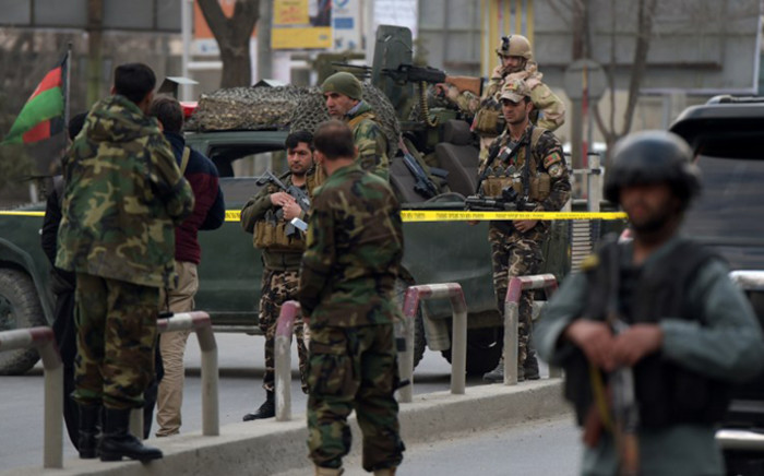 FILE: Afghan security personnel gather near the site of an explosion in Kabul on 8 March, 2017. An explosion and gunfire rattled Kabul’s diplomatic district, as insurgents attacked Afghanistan's largest military hospital, officials said. Picture: AFP