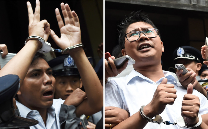FILE: This combo photo shows journalists Kyaw Soe Oo (L) and Wa Lone (R) being escorted by police after their sentencing by a court to jail in Yangon on 3 September 2018. Picture: AFP.