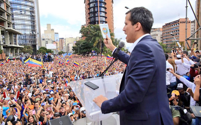 Venezuela's opposition leader Juan Guaido waves to his supporters during a rally. PIcture: @jguaido/Twitter.