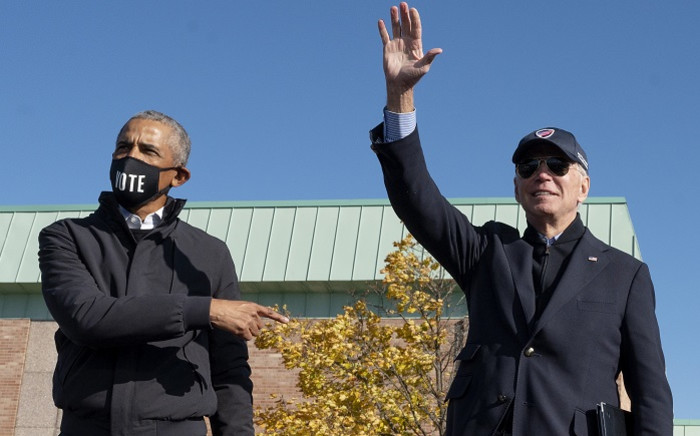 Former US President Barack Obama (L) joins Democratic presidential candidate Joe Biden at a campaign event in Flint, Michigan, on 31 October 2020. Picture: AFP.
