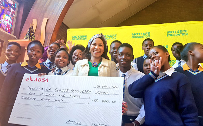 Dr Precious Motsepe poses with learners from a school in Soweto where the Motsepe Foundation donated money. Picture: Twitter/@EducationGP