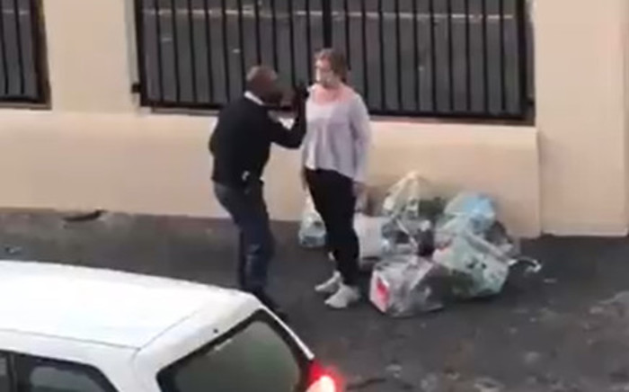 Screengrab of video showing police altercation with mask-wearing woman in Strand on Friday, 22 May 2020 during the COVID-19 lockdown. A probe into the conduct of the two officers involved in the incident is underway. Picture: Twitter video|@MurrayRSA