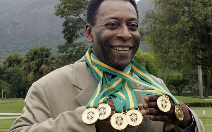 FILE: Brazilian football legend Edson Arantes do Nascimento, known as 'Pele', poses with his six Brazil's champion medals on December 22, 2010 during a ceremony in Rio de Janeiro, Brazil. Picture: AFP