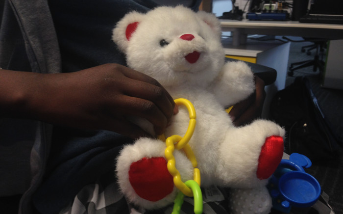 An 11-year-old girl holds her favourite toy, she was allegedly raped by the owner of a daycare centre. Picture: Vumani Mkhize/EWN.