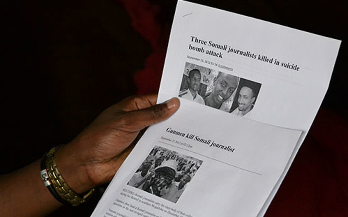 A Somali journalist in South Africa, who claims he has received death threats from Al-Shabab, shows EWN news reports on the deaths of some of his colleagues. Picture: Aletta Gardner/EWN 