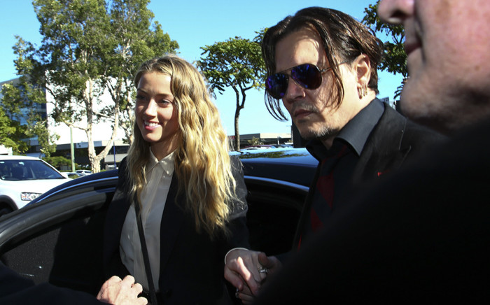 FILE: This file photo taken on 17 April, 2016 shows US actor Johnny Depp and his wife Amber Heard as they arrive at a court in the Gold Coast. Picture: AFP.
