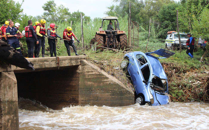 Recovery efforts came to a disappointing end as a Nissan Micra was pulled from the Apies River north of Pretoria. The car was swept away in a flash flood during heavy rains on Thursday. Picture: Christa Eybers/EWN.