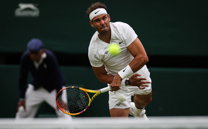 Spain's Rafael Nadal serves the ball to Lithuania's Ricardas Berankis during their men's singles tennis match on the fourth day of the 2022 Wimbledon Championships at The All England Tennis Club in Wimbledon, southwest London, on 30 June 2022. Picture: Adrian DENNIS/AFP