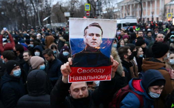 FILE: Protesters march in support of jailed opposition leader Alexei Navalny in downtown Moscow on 23 January 2021. The placard with an image of the Kremlin critic reads "Freedom to Navalny!". Picture: Kirill KUDRYAVTSEV/AFP