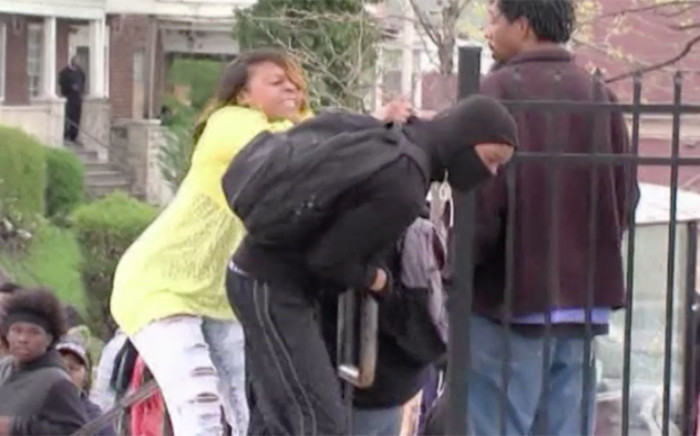 Mother beats her son in public as he attaends to join Baltimore riot. Picture; CNN
