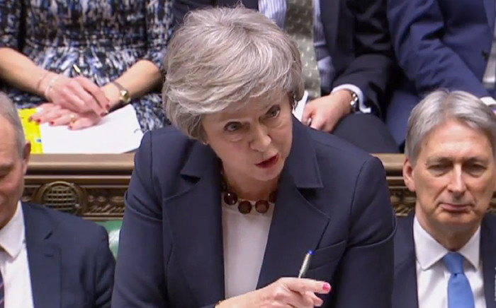 A video grab from footage broadcast by the UK Parliament's Parliamentary Recording Unit shows Britain's Prime Minister Theresa May as she speaks during the weekly Prime Minister's Questions in the House of Commons in London on 9 January 2019. Picture: AFP.
