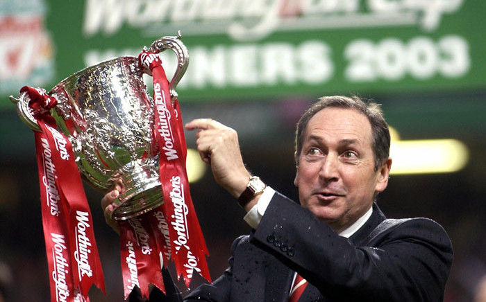 FILE: Liverpool's French manager Gerard Houllier holds the cup aloft celebrating victory over Manchester United in the Worthington Cup Final at the Millenium stadium in Cardiff 2 March 2003. Picture: AFP