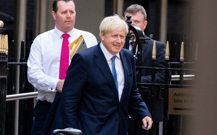 FILE: New Conservative Party leader and Prime Minister Boris Johnson leaves the Conservative party headquarters in central London on 23 July, 2019. Picture: AFP.