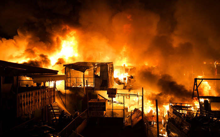 A fire burns through an informal settlement as it burns hundreds of houses in Delpan, Tondo, Manila on February 7, 2017. Picture: AFP