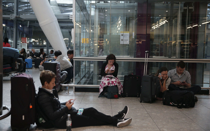 Travellers stranded wait at Heathrow Airport Terminal 5 after British Airways flights where cancelled at Heathrow Airport in west London on 27 May 2017. Picture: AFP