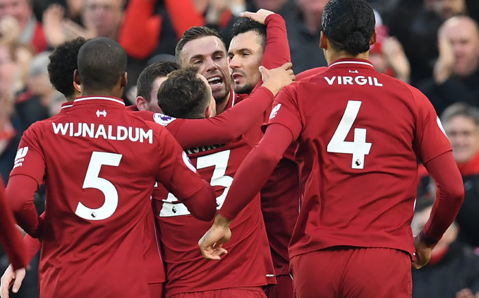 Liverpool defender Dejan Lovren (C) celebrates with teammates after scoring the opening goal of the English Premier League football match against Newcastle United at Anfield in Liverpool, north-west England on 26 December 2018. Picture: AFP