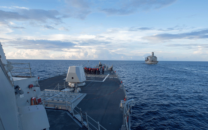 FILE: The Arleigh Burke-class guided-missile destroyer 'USS Dewey' (L) preparing for a replenishment-at-sea with the Henry J. Kaiser-class fleet replenishment oiler 'USNS Pecos' (R) in the South China Sea. Picture: AFP