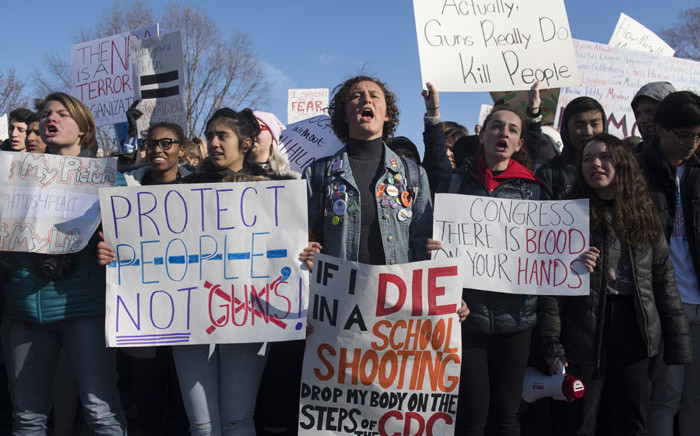 FILE: Thousands of local students protest as they rally during a nationwide student walkout for gun control in front the White House in Washington, DC, 14 March, 2018. Picture: AFP