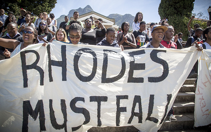 Marching down the steps towards the Cecil John Rhodes statue and using the slogan "Rhodes Must Fall" some students are demanding the statue must be taken down on the University of Cape Town's campus, as it represents institutional racism. Picture: Thomas Holder/EWN