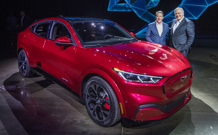 Ford CEO James Hackett (R) and a team member reveal the company's first mass-market electric car the Mustang Mach-E, which is an all-electric vehicle that bears the name of the company’s iconic muscle car at a ceremony in Hawthorne, California on 17 November 2019. Picture: AFP