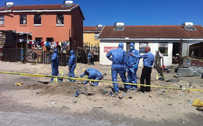 Police forensics dig behind the Mitchells Plain homes of Shaskia Michaels and Kauthar Bobbs on 18 October 2013. Picture: Siyabonga Sesant/EWN