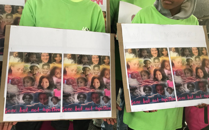 Children holding placards of young victims of gang-related shootings during a demonstration in Bonteheuwel. Picture: Monique Mortlock/EWN.