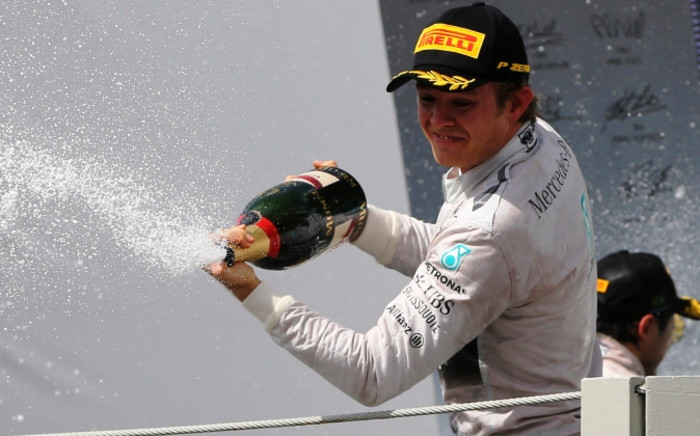German driver Nico Rosberg, of Mercedes, celebrates his first place on the podium after the Brazilian Formula One Grand Prix in the Interlagos race track in Sao Paulo, Brazil, 9 November 2014 Picture: EPA.