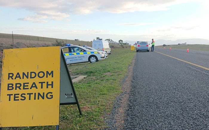 A Western Cape traffic official conducts a random breath testing on the N2 highway. Picture: @WCGovSafelyHome/Twitter.