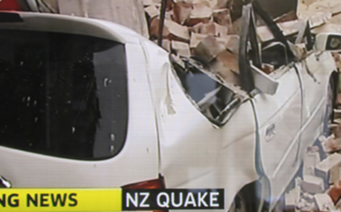 TV frame shows a car destroyed by damage caused by a 6.3 earthquake which hit the city of Christchurch on February 22, 2011. Picture: AFP