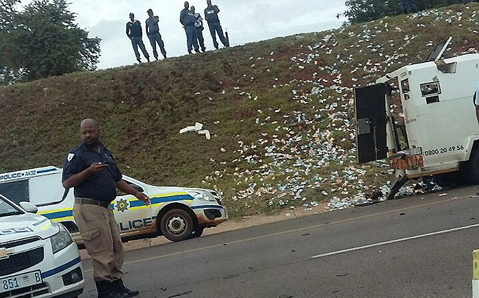 Cash littered the ground following  a heist on the N4 in Pretoria on 23 February 2018. Picture: @LuckyEvansCeo/twitter.com