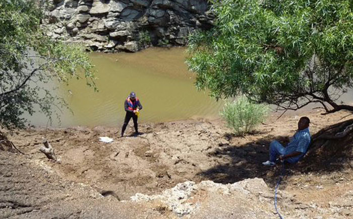 Police divers searched for bodies of two men who were tied up, assaulted and thrown in dam at Marikana. Picture: @SAPoliceService. 