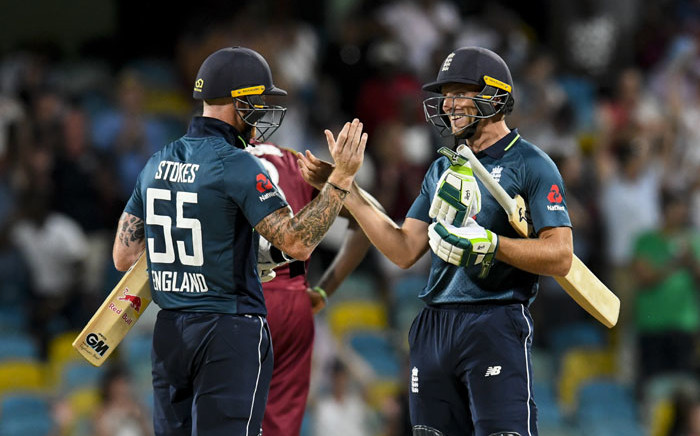 Ben Stokes (L) and Jos Buttler (R) of England celebrate winning the 1st ODI between West Indies and England at Kensington Oval, Bridgetown, Barbados, on 20 February 2019. Picture: AFP