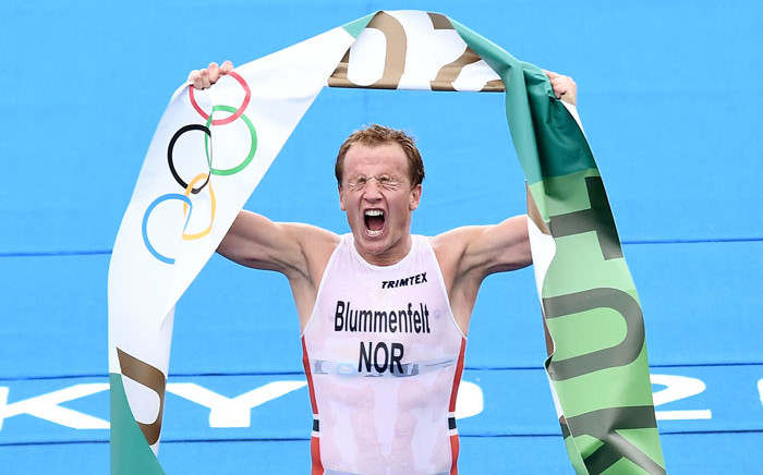 Norway's Kristian Blummenfelt celebrates finishing first to win gold in the men's individual triathlon competition during the Tokyo 2020 Olympic Games at the Odaiba Marine Park in Tokyo on 26 July 2021. Picture: Loic Venance/AFP