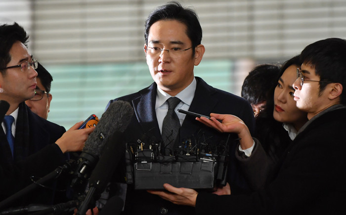 FILE: Lee Jae-Yong, vice chairman of Samsung Electronics, arrives to be questioned as a suspect in a corruption scandal that led to the impeachment of South Korea’s President Park Geun-Hye, at the office of the independent counsel in Seoul on 13 February, 2017. Picture: AFP