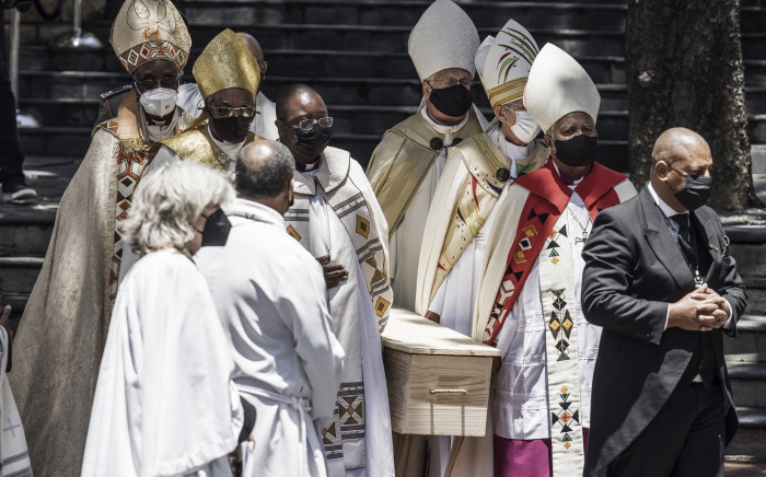 Pallbearers carry the coffin of Archbishop Desmond Tutu to the hearse after the requiem mass of Tutu at St. George’s Cathedral in Cape Town on 1 January 2022. Picture: AFP