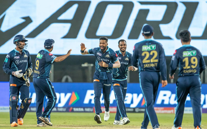 Gujarat Titans players celebrate the fall of a wicket in their Indian Premier League game against Lucknow Super Giants on 10 May 2022. Picture: @gujarat_titans/Twitter