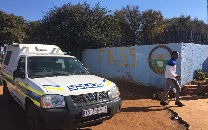 Police are seen outside the Fred Norman Secondary School in Ennerdale where a shooting took place on 5 June 2018, where a teenager was allegedly shot by his father after late-night classes. Picture: EWN