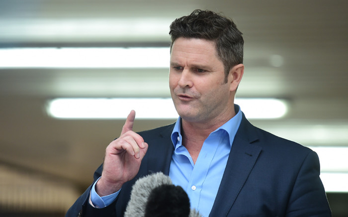 Ex-New Zealand cricket captain Chris Cairns speaks to the press outside Southwark Crown Court in central London on 30 November, 2015. Picture: AFP.