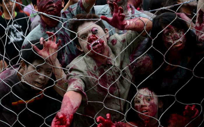 FILE: Students dressed as zombies participate in an annual Halloween Costume Parade in Manila on October 30, 2013. Picture: AFP.
