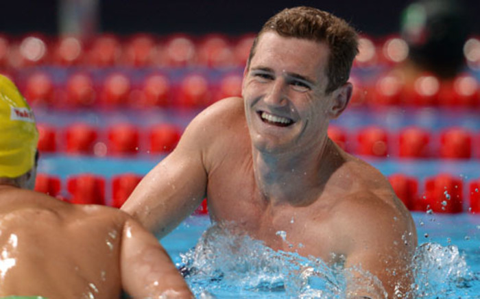 SPAIN, Barcelona: South Africa's Cameron Van Der Burgh celebrates after winning the final of the men's 50-metre breaststroke swimming event in the FINA World Championships at Palau Sant Jordi in Barcelona on July 31, 2013. Picture: AFP 