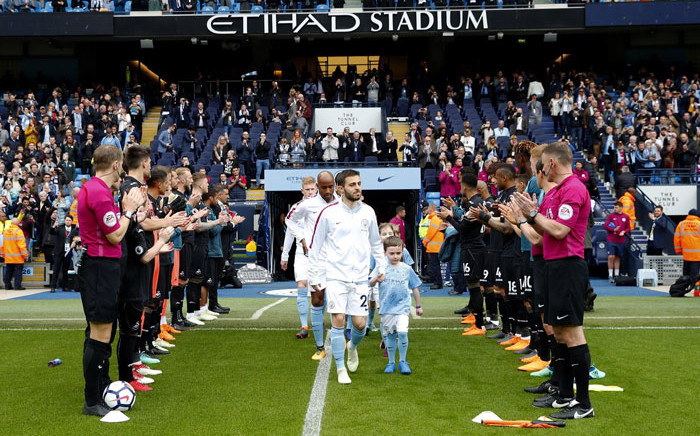Champions Manchester City receive a guard of honour from Swansea players ahead of their English Premier League. Picture: @ManCity/Twitter