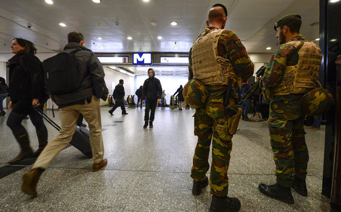 Military police patrol the Brussels-South (Brussel Zuid/Midi) train station in Brussels on November 18, 2015. The national security level has been raised to three, after several terrorist attacks in Paris on November 13 left 129 dead and more than 350 injured. Picture: AFP.