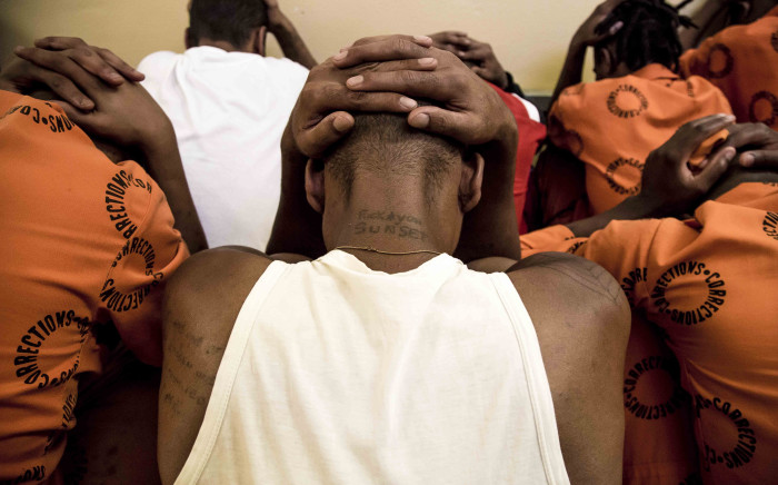 Offenders sit together under guard at Pollsmoor Prison in Cape Town. Picture: Thomas Holder/EWN. 